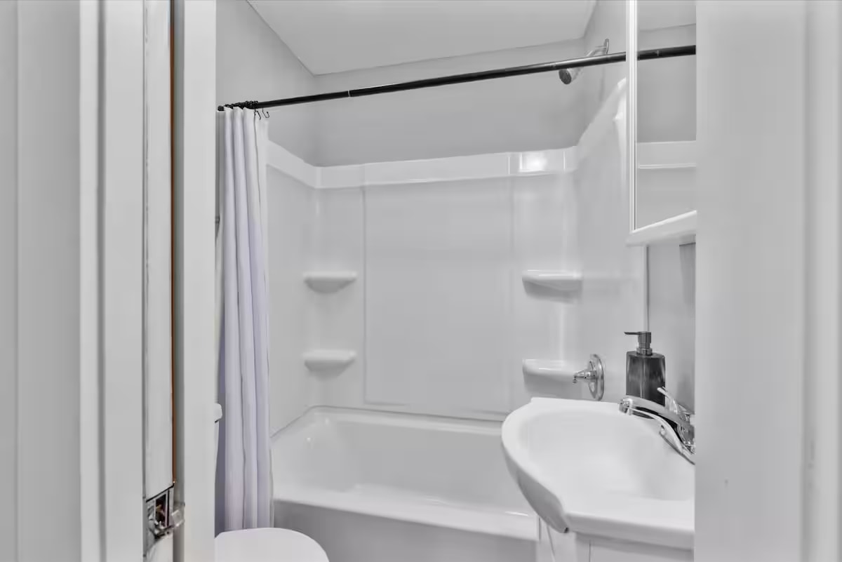 Bathroom with tub and shower