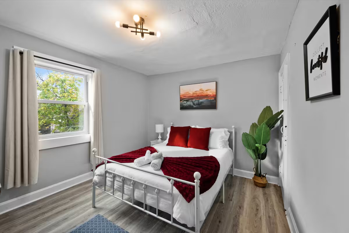 Queen bedroom with red accents