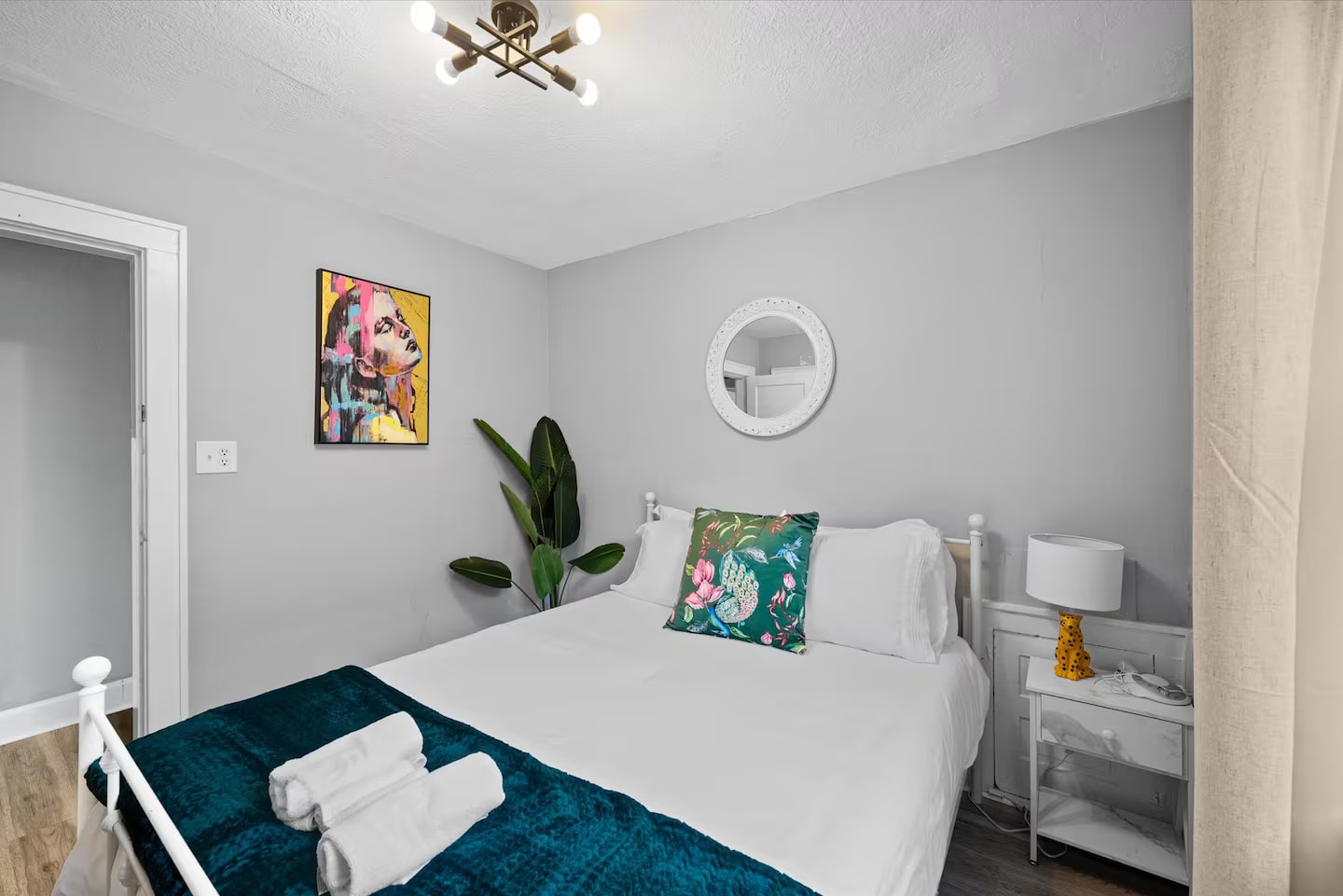 Queen bedroom with teal accents