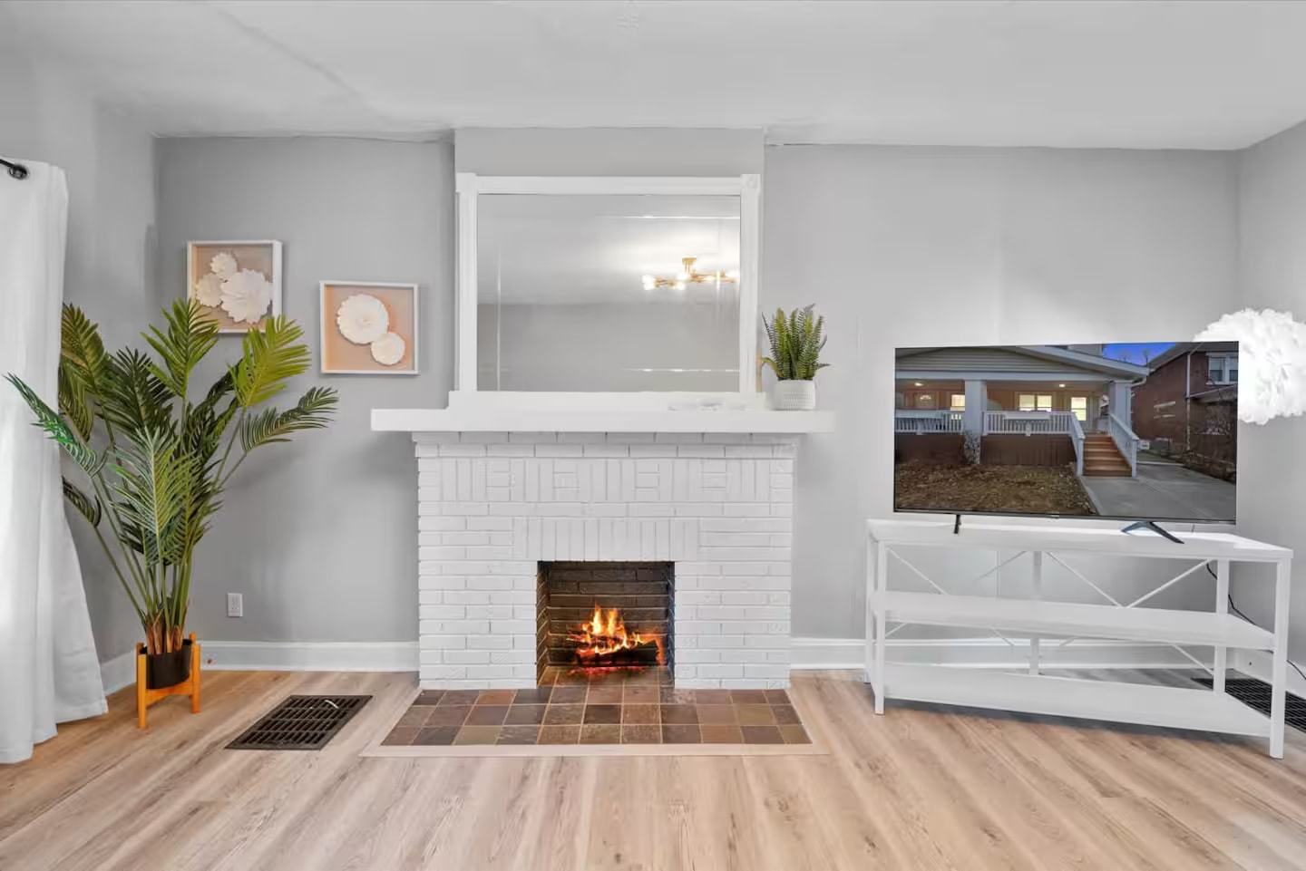 Living room with fireplace and television